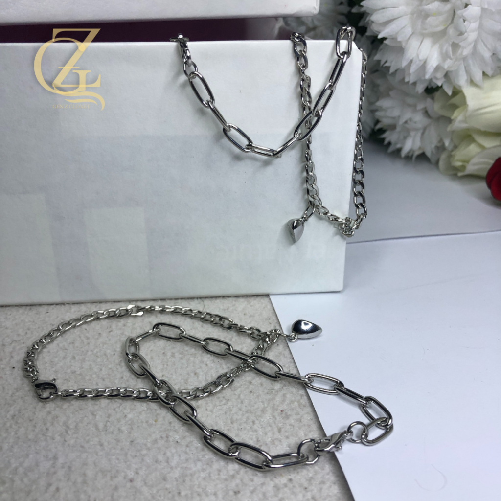 The "Attraction" Set: Magnetic Heart & Mixed Link Couple’s Bracelets Street-Luxe Pair: Silver Paperclip & Curb Chain Magnetic Set Connected Chains: Unisex Magnetic Heart Link Bracelet Pair The Bond Set: Industrial Mixed-Chain Matching Bracelets