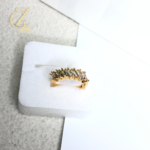 Adjustable silver couple rings with swirl design and round-cut stone on white background.