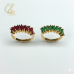 Adjustable silver couple rings with swirl design and round-cut stone on white background.