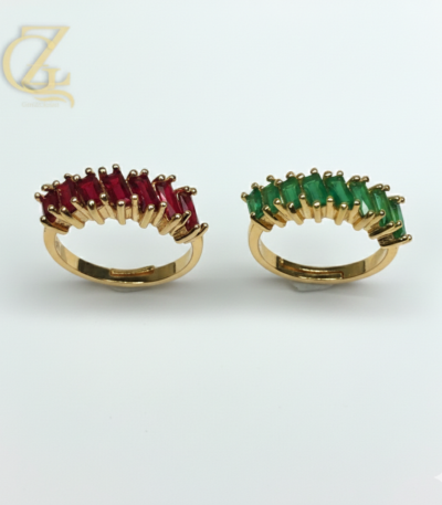 Adjustable silver couple rings with swirl design and round-cut stone on white background.