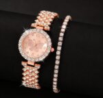 Elegant gold-toned women's quartz watch featuring a butterfly dial design alongside a matching gold crystal bracelet.